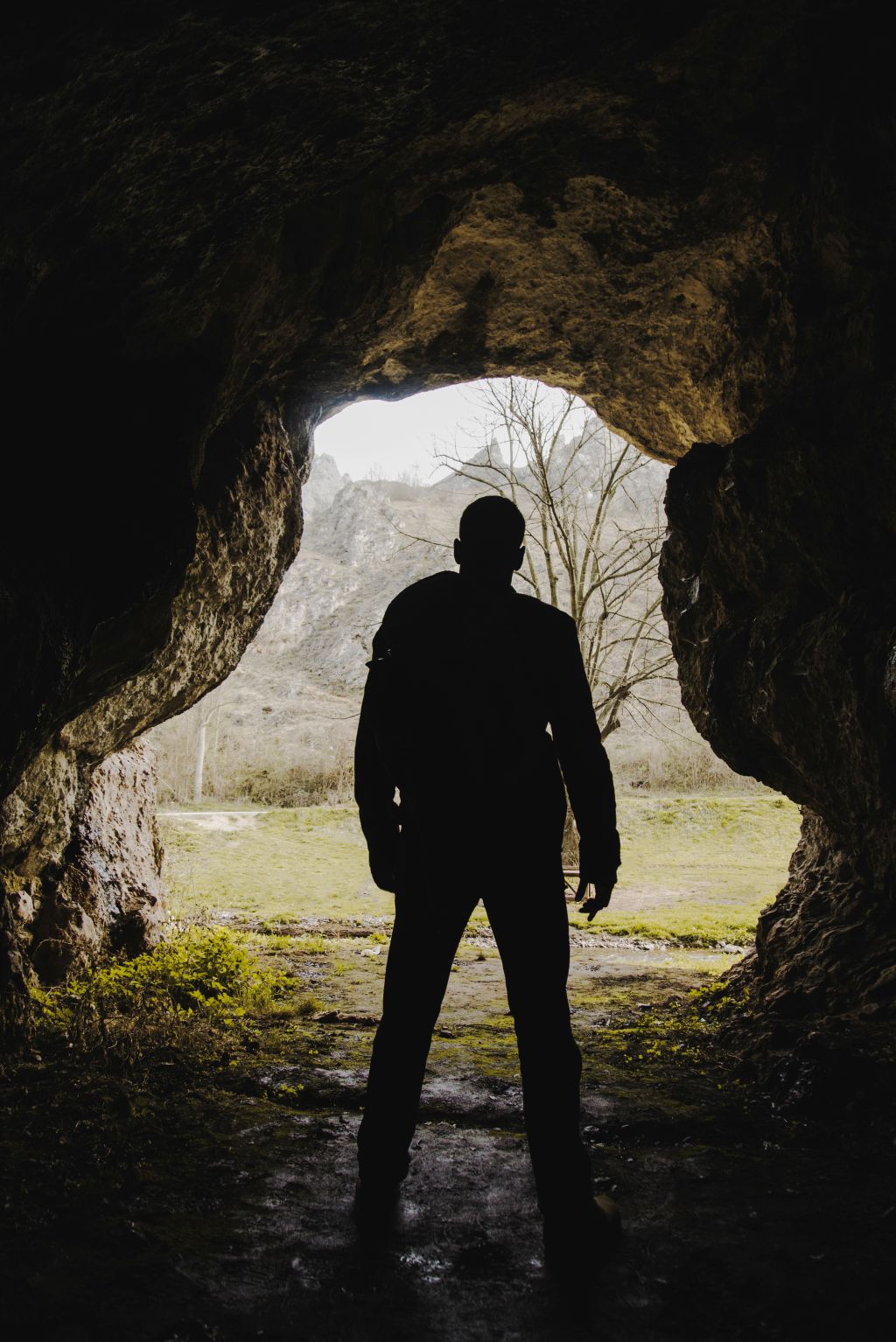 hiker-exploring-cave hiker-exploring-cave